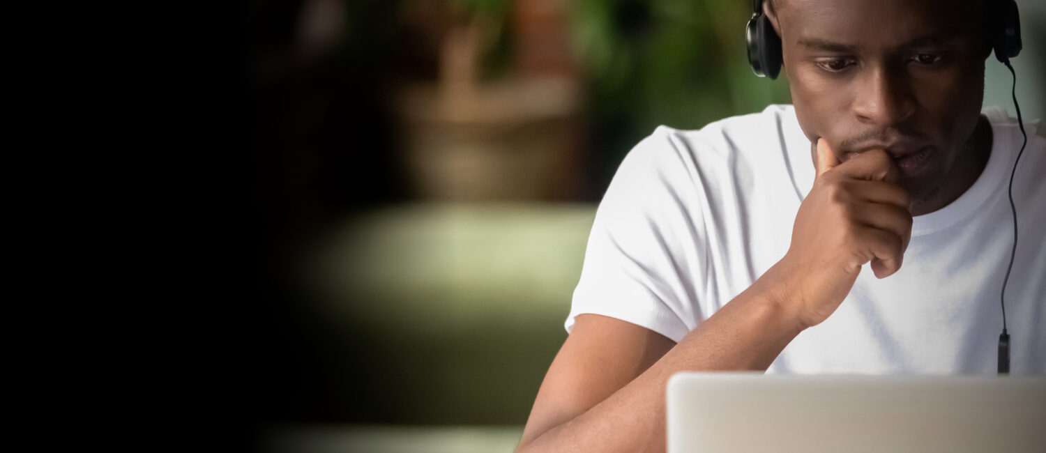 Image of person looking at a laptop.