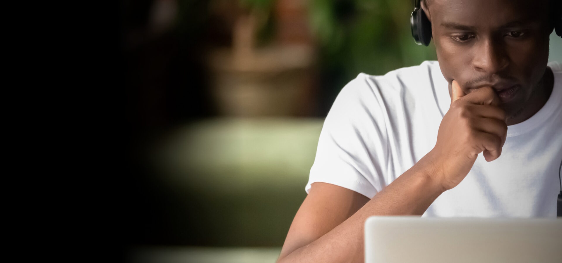 Image of person looking at a laptop.